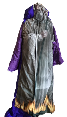 A costume by isabelle lange that is a statue of a bearded man in a long, flowing robe with a purple hood and fiery details around the hem, standing with crossed arms, that was printed on fabric. ISO LA - Isabelle Lange